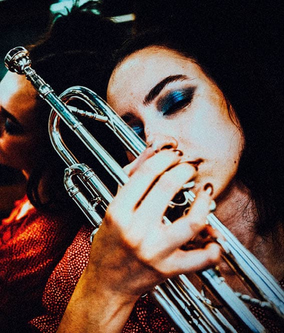 beautiful young woman, rebellion, headshot, retro style, sensuality, trumpet, clubbing, party, jazz,