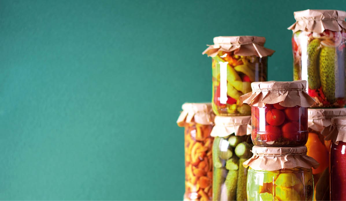 Ð ucumber, squash and tomatoes pickling and canning into glass jars  Ingredients for vegetables preserving  Healthy fermented food concept  Harvest storing 