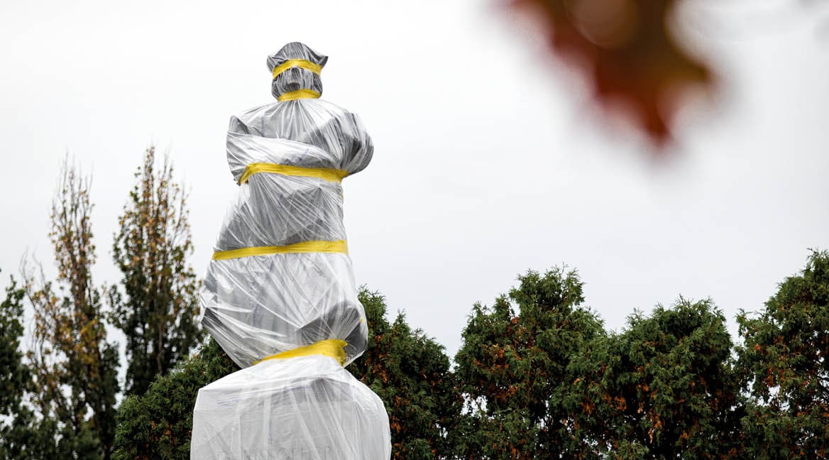 A statue of Christopher Columbus is seen taped and wrapped on Columbus Day on Oct  12, 2020, in Schenley Park, in Pittsburgh PA  The statue has been recommended for removal by Pittsburgh Mayor Bill Peduto and the city's art council 