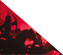 Medieval battle scene with cavalry and infantry. Silhouettes of figures as separate objects, fight between warriors on dark toned foggy background. Night scene. Selective focus