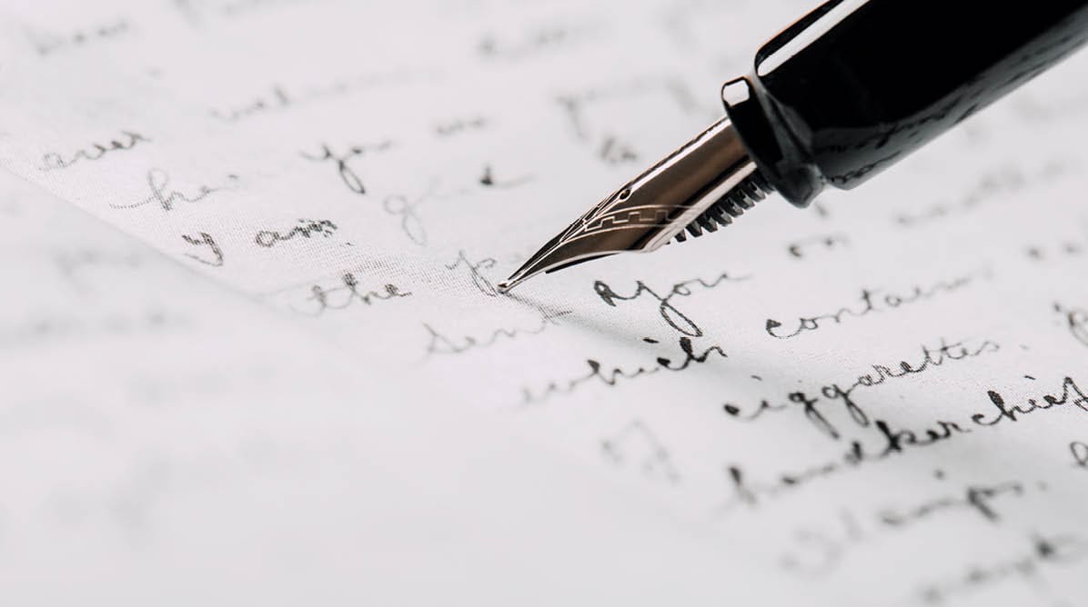 fountain pen on paper with ink text closeup