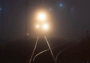 Railway tracks in the night foggy city of Yokohama, Japan