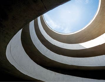 Leipzig, Germany: A modern driveway in a parking garage with a lot of curves.