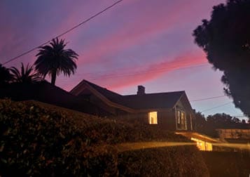 Sky is lit up by pink striped clouds at sunset