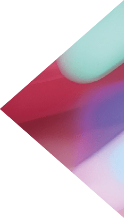 A young,stylish woman with wavy pink hair is posing confidently in a vibrant,neon-lit studio setting She exudes a captivating stage presence and charm,likely as a popular K-pop or performer The image