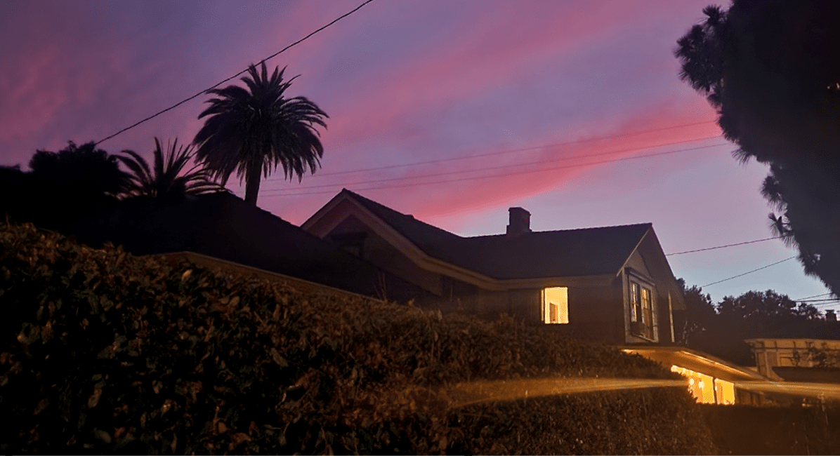 Sky is lit up by pink striped clouds at sunset