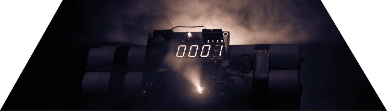 Image of a time bomb against dark background. Timer counting down to detonation illuminated in a shaft light shining through the darkness, conceptual image